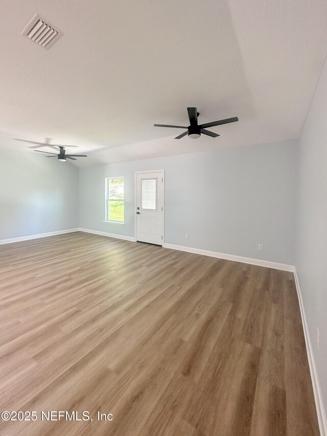 112 Moseley Ave, Palatka, FL 32177 - spare room featuring a ceiling fan, baseboards, and wood finished floors
