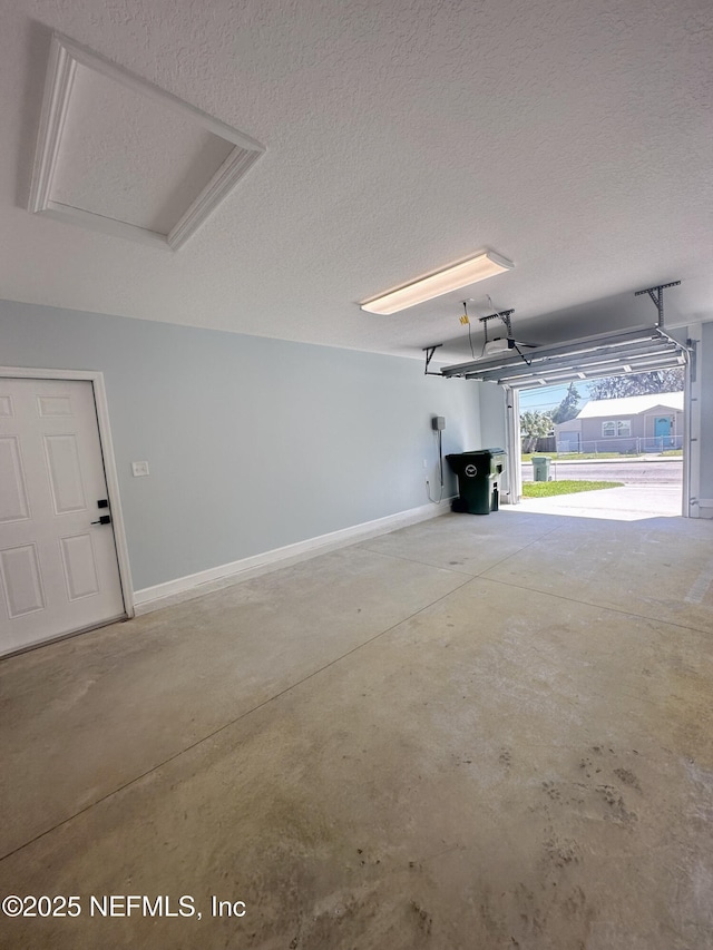 112 Moseley Ave, Palatka, FL 32177 - garage featuring baseboards