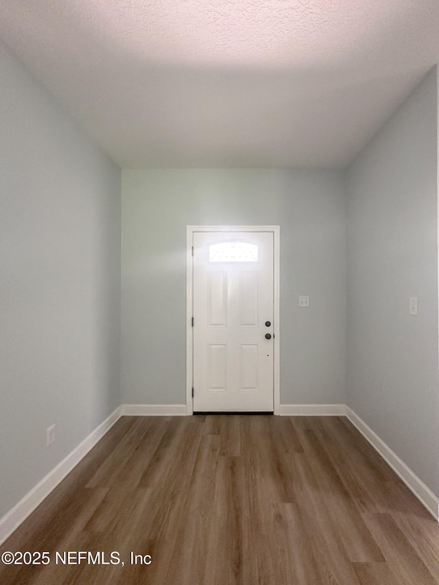112 Moseley Ave, Palatka, FL 32177 - foyer entrance with wood finished floors and baseboards