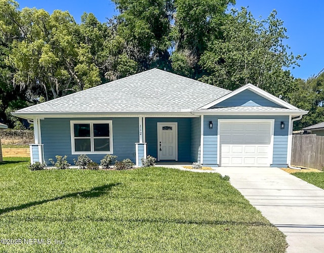 112 Moseley Ave, Palatka, FL 32177 - ranch-style house featuring an attached garage, driveway, a shingled roof, and a porch
