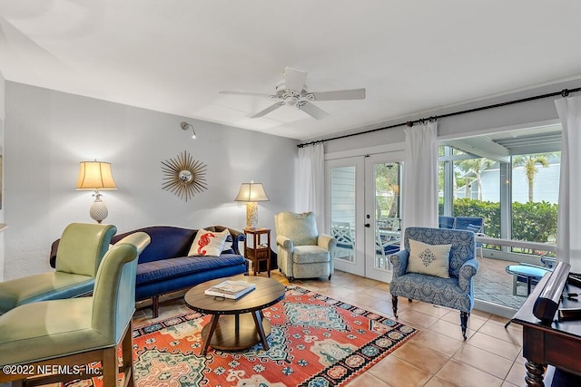 living area featuring a ceiling fan, french doors, and light tile patterned flooring