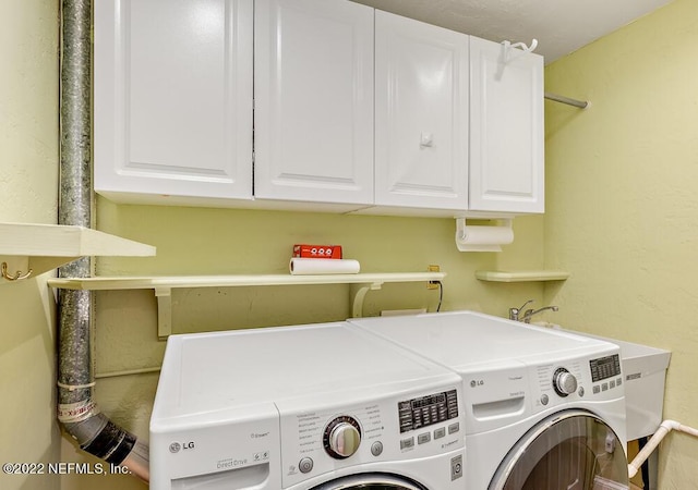 laundry area with cabinet space and washing machine and clothes dryer