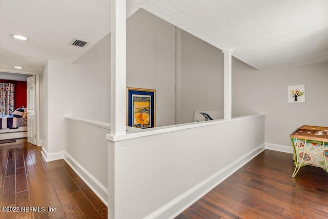 hall with recessed lighting, baseboards, visible vents, and hardwood / wood-style flooring