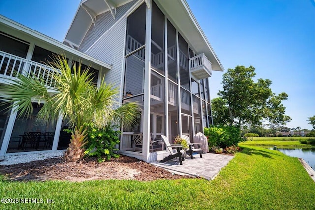 272 Deer Run Ln, Ponte Vedra Beach, FL 32082 - exterior space featuring a patio, a lawn, a water view, and a sunroom
