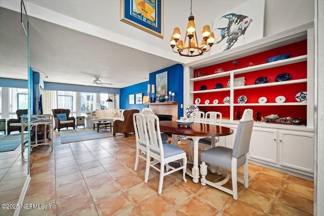 272 Deer Run Ln, Ponte Vedra Beach, FL 32082 - dining area with a chandelier, light tile patterned flooring, built in features, and ceiling fan