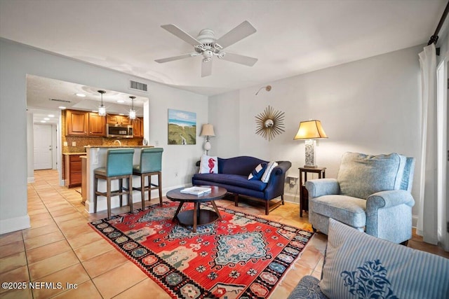 272 Deer Run Ln, Ponte Vedra Beach, FL 32082 - living room with light tile patterned floors, ceiling fan, and baseboards