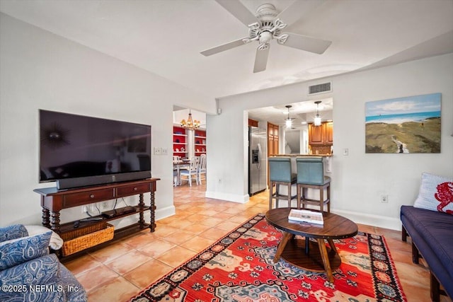 272 Deer Run Ln, Ponte Vedra Beach, FL 32082 - living room featuring a chandelier, ceiling fan, baseboards, and light tile patterned floors