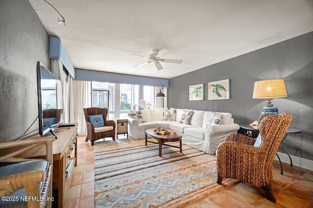 272 Deer Run Ln, Ponte Vedra Beach, FL 32082 - living room with ceiling fan, a textured wall, and light tile patterned floors