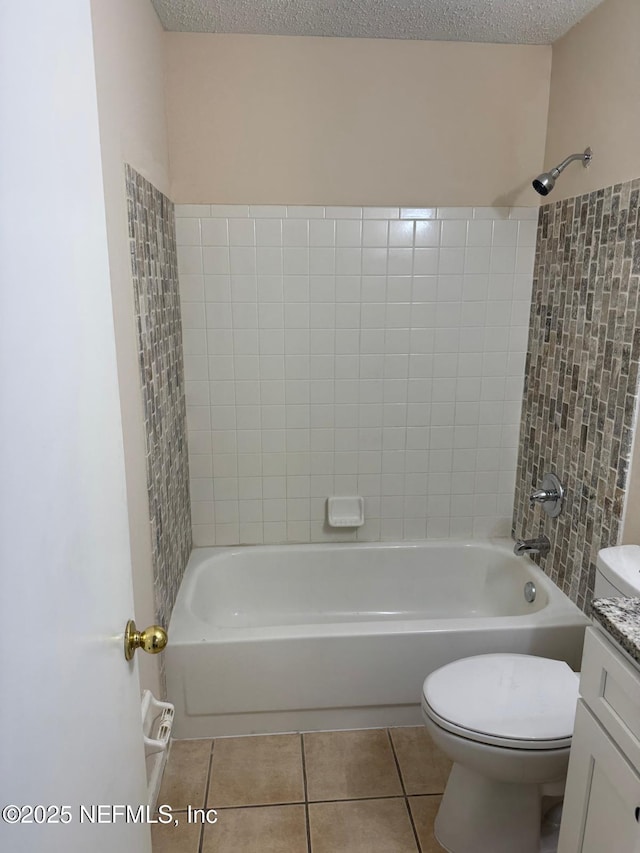 5006 Knightsbridge Cir N, Jacksonville, FL 32244 - full bath featuring tile patterned floors, a textured ceiling, toilet, shower / bathing tub combination, and vanity