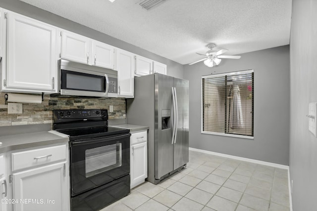 kitchen featuring tasteful backsplash, visible vents, white cabinets, ceiling fan, and stainless steel appliances