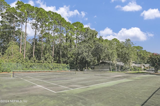 view of sport court with fence