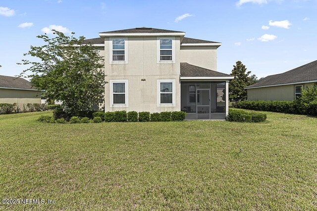 3410 Ridgeview Dr, Green Cove Springs, FL 32043 - back of house featuring a sunroom, a lawn, roof with shingles, and stucco siding