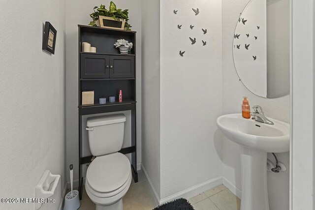 3410 Ridgeview Dr, Green Cove Springs, FL 32043 - half bathroom with toilet, tile patterned floors, and baseboards