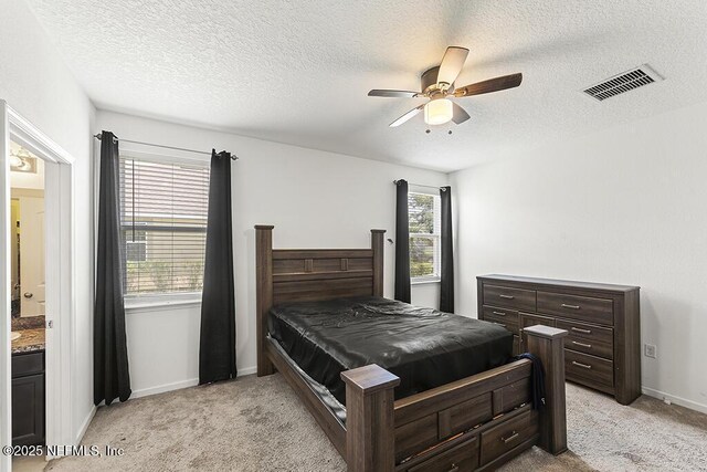3410 Ridgeview Dr, Green Cove Springs, FL 32043 - bedroom with light colored carpet, a textured ceiling, baseboards, and ceiling fan
