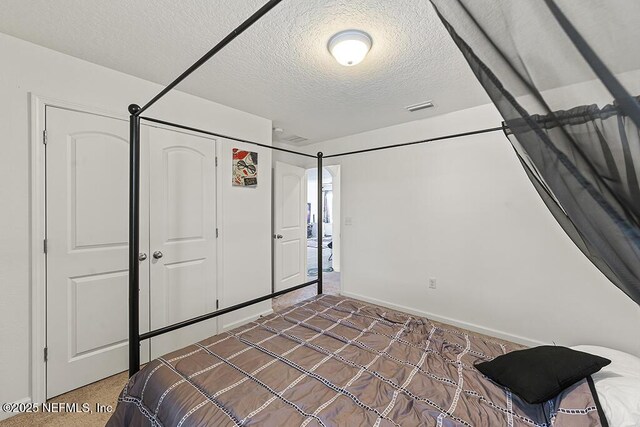 3410 Ridgeview Dr, Green Cove Springs, FL 32043 - bedroom featuring a textured ceiling and baseboards