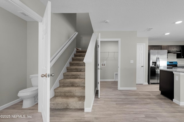 12171 Calais St, Jacksonville, FL 32224 - staircase featuring visible vents, baseboards, wood finished floors, and recessed lighting