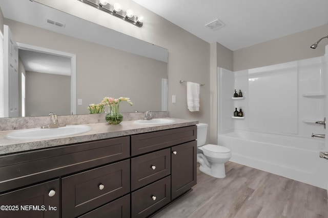 12171 Calais St, Jacksonville, FL 32224 - bathroom featuring visible vents, a sink, shower / tub combination, and toilet
