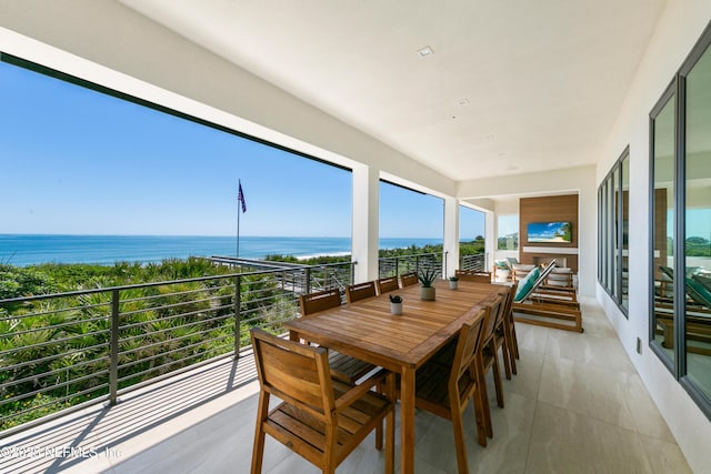 sunroom / solarium with a water view