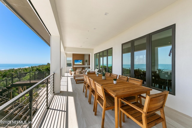 balcony featuring a water view