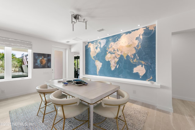 dining space featuring a healthy amount of sunlight, recessed lighting, light wood-type flooring, and visible vents