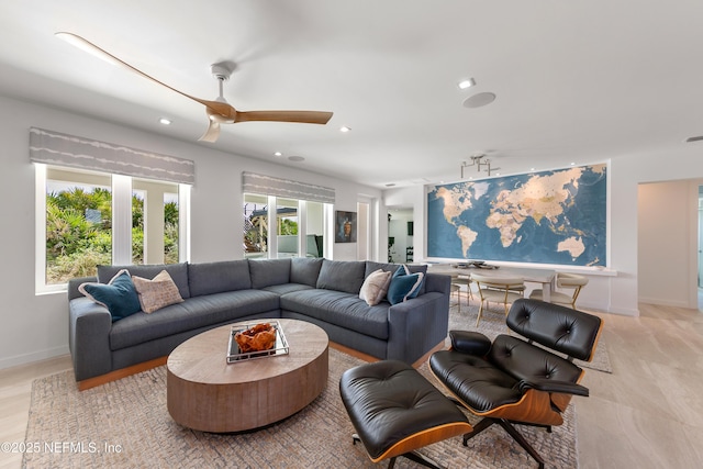 living room with recessed lighting, a ceiling fan, and baseboards