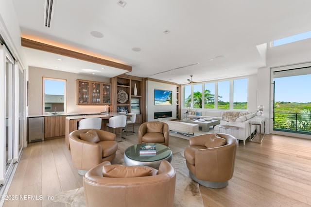 living room with recessed lighting and light wood finished floors