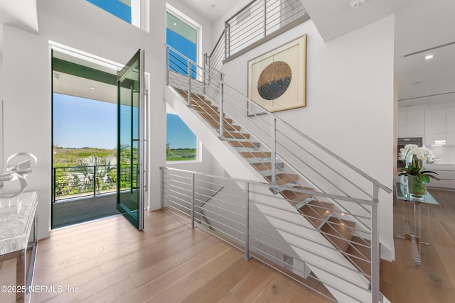 staircase featuring wood finished floors