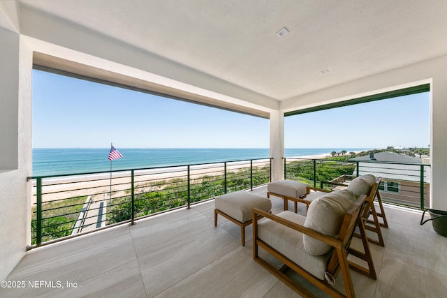 balcony with a view of the beach and a water view