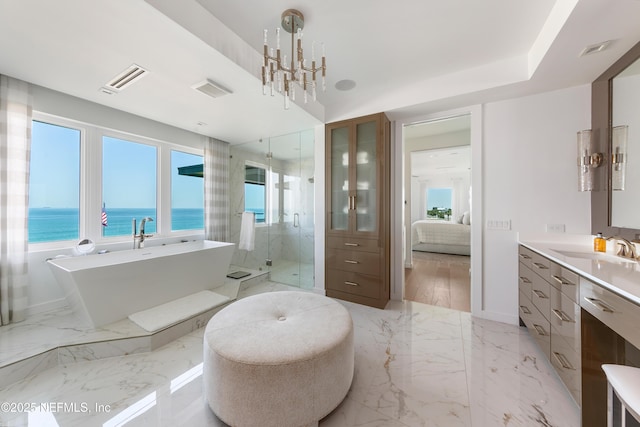full bathroom featuring vanity, a healthy amount of sunlight, ensuite bathroom, and a stall shower