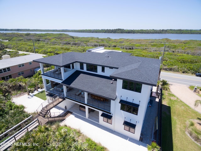 birds eye view of property with a water view