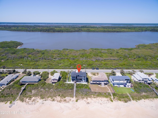 bird's eye view featuring a water view and a view of trees