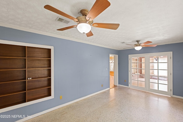 empty room with speckled floor, ceiling fan, baseboards, and visible vents