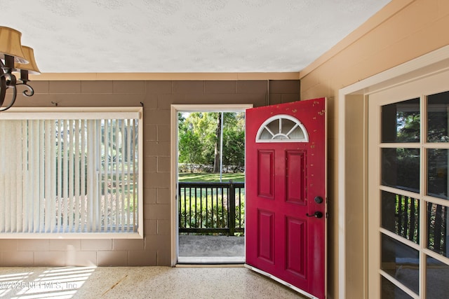 entrance foyer with speckled floor