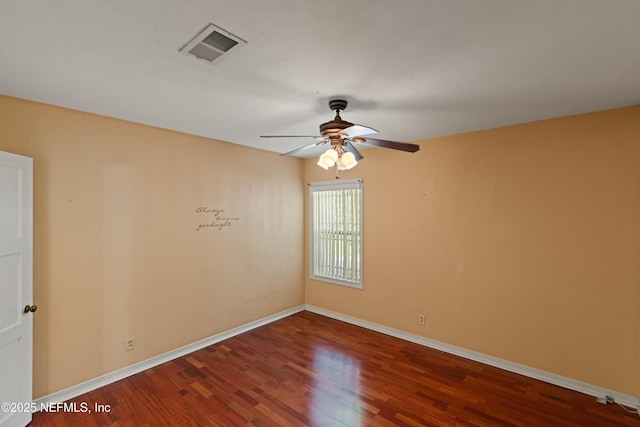 unfurnished room with ceiling fan, baseboards, wood finished floors, and visible vents