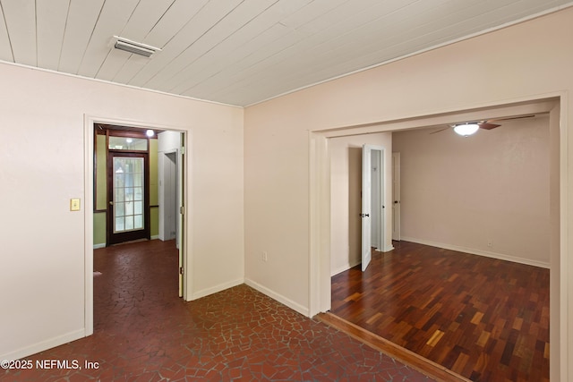 hall featuring wood ceiling, baseboards, and visible vents