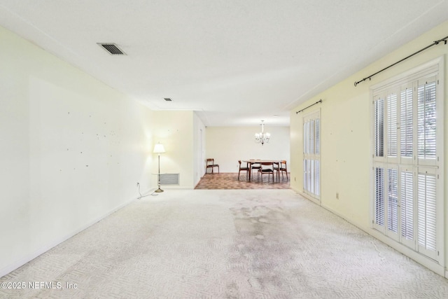 2815 Sylvan Ln S, Jacksonville, FL 32257 - unfurnished room with visible vents, carpet, and a chandelier