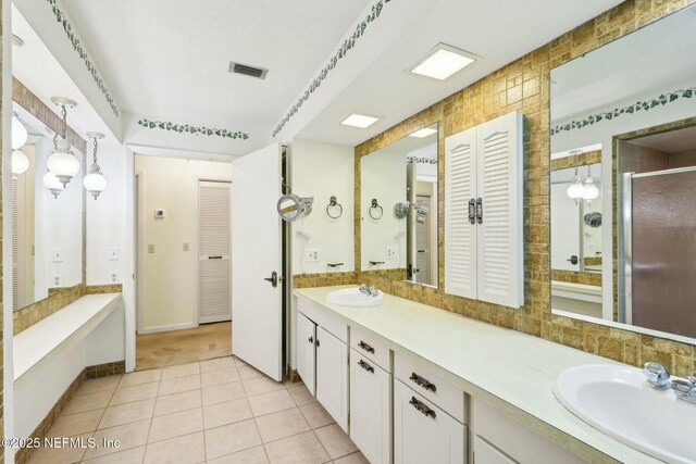 2815 Sylvan Ln S, Jacksonville, FL 32257 - bathroom with a closet, visible vents, a stall shower, and a sink