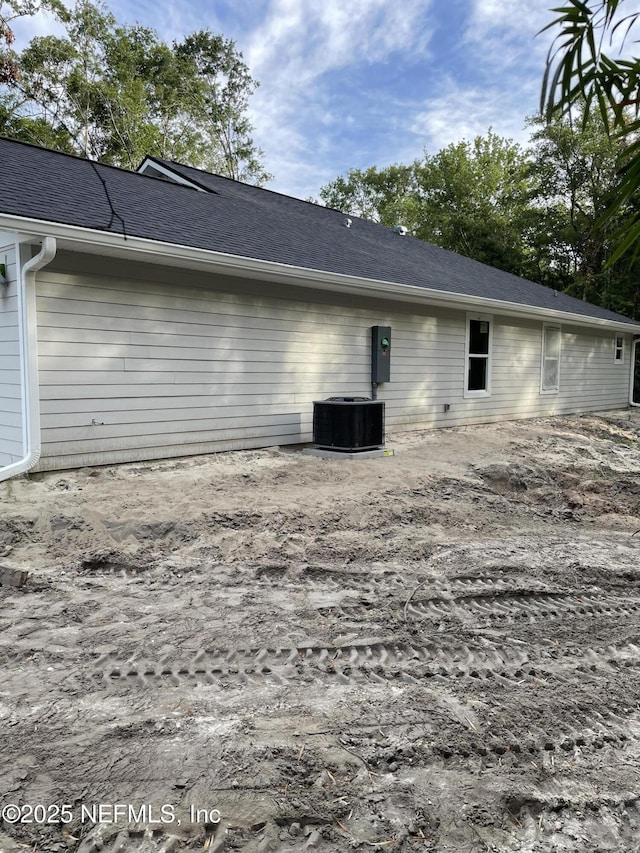 6333 Fox Hollow Ct, Hampton, FL 32044 - view of property exterior with a cooling unit and roof with shingles
