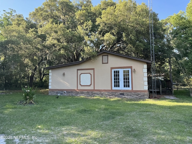 view of outdoor structure featuring french doors