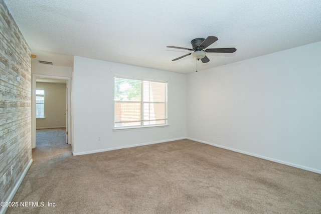 2631 Tuscany Glen Dr, Orange Park, FL 32065 - unfurnished room with a ceiling fan, carpet, and a textured ceiling