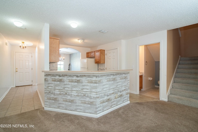 2631 Tuscany Glen Dr, Orange Park, FL 32065 - kitchen featuring freestanding refrigerator, light tile patterned floors, and light colored carpet
