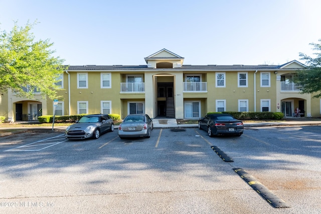 3671 Kirkpatrick Cir Unit 14, Jacksonville, FL 32210 - view of building exterior with uncovered parking