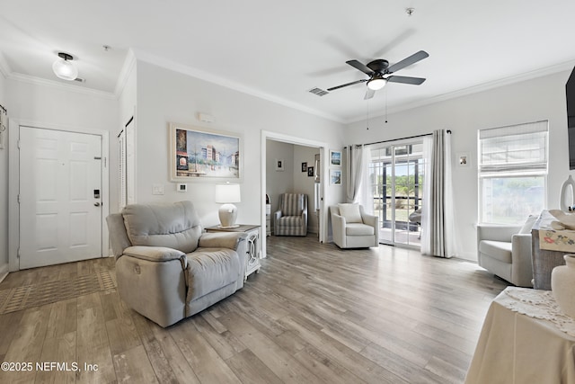 115 Legendary Dr Unit 106, Saint Augustine, FL 32902 - living room featuring ceiling fan, visible vents, ornamental molding, and light wood finished floors