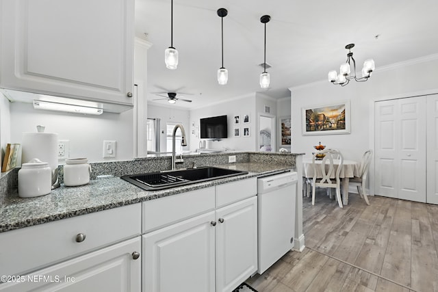 115 Legendary Dr Unit 106, Saint Augustine, FL 32902 - kitchen featuring dishwasher, a sink, white cabinets, ceiling fan with notable chandelier, and ornamental molding