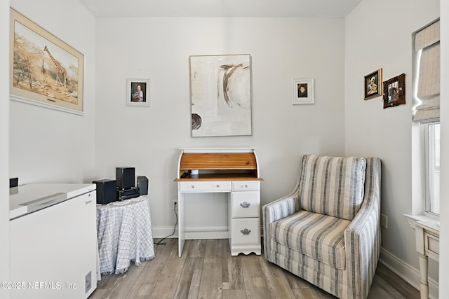 115 Legendary Dr Unit 106, Saint Augustine, FL 32902 - living area with baseboards and wood finished floors