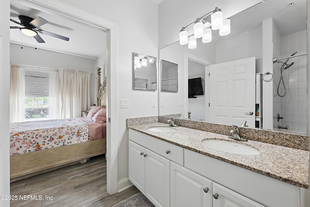 115 Legendary Dr Unit 106, Saint Augustine, FL 32902 - ensuite bathroom with a sink, double vanity, ensuite bath, and wood finished floors
