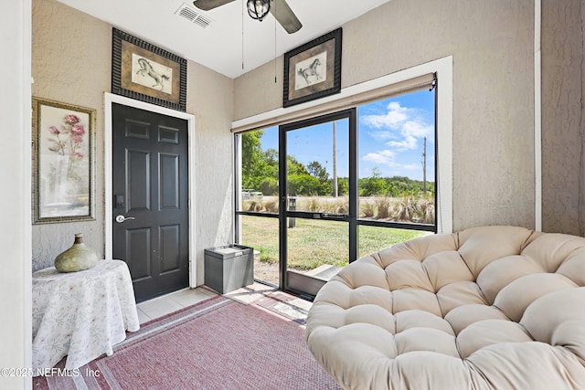 115 Legendary Dr Unit 106, Saint Augustine, FL 32902 - interior space featuring light tile patterned floors, a textured wall, a ceiling fan, and visible vents