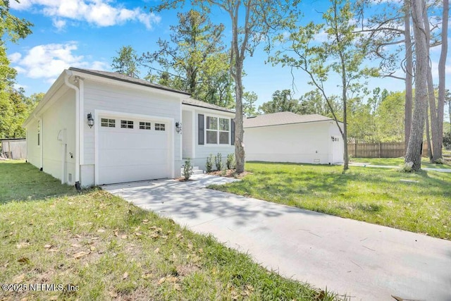 5454 Amazon Ave, Jacksonville, FL 32254 - view of front of property with a front lawn, driveway, fence, and a garage