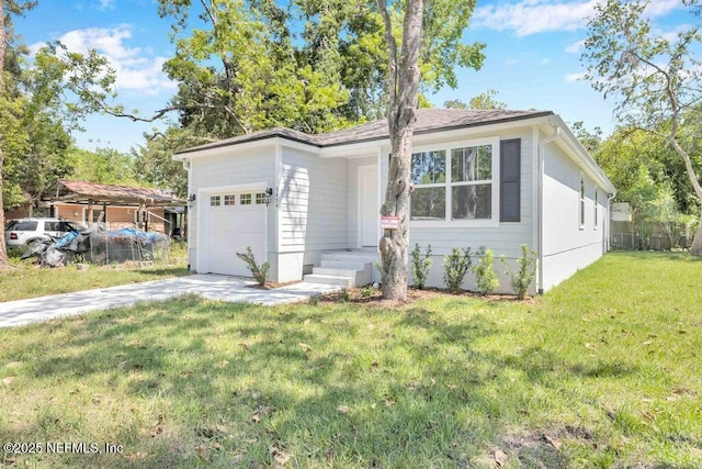 5454 Amazon Ave, Jacksonville, FL 32254 - view of front of property featuring an attached garage, a front yard, fence, and driveway