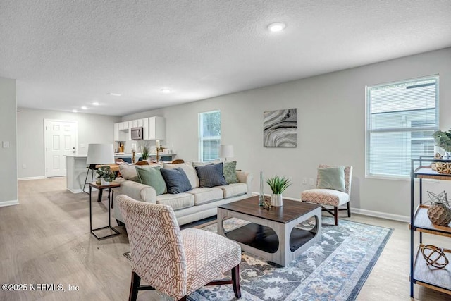 5454 Amazon Ave, Jacksonville, FL 32254 - living area with recessed lighting, light wood-style flooring, a textured ceiling, and baseboards
